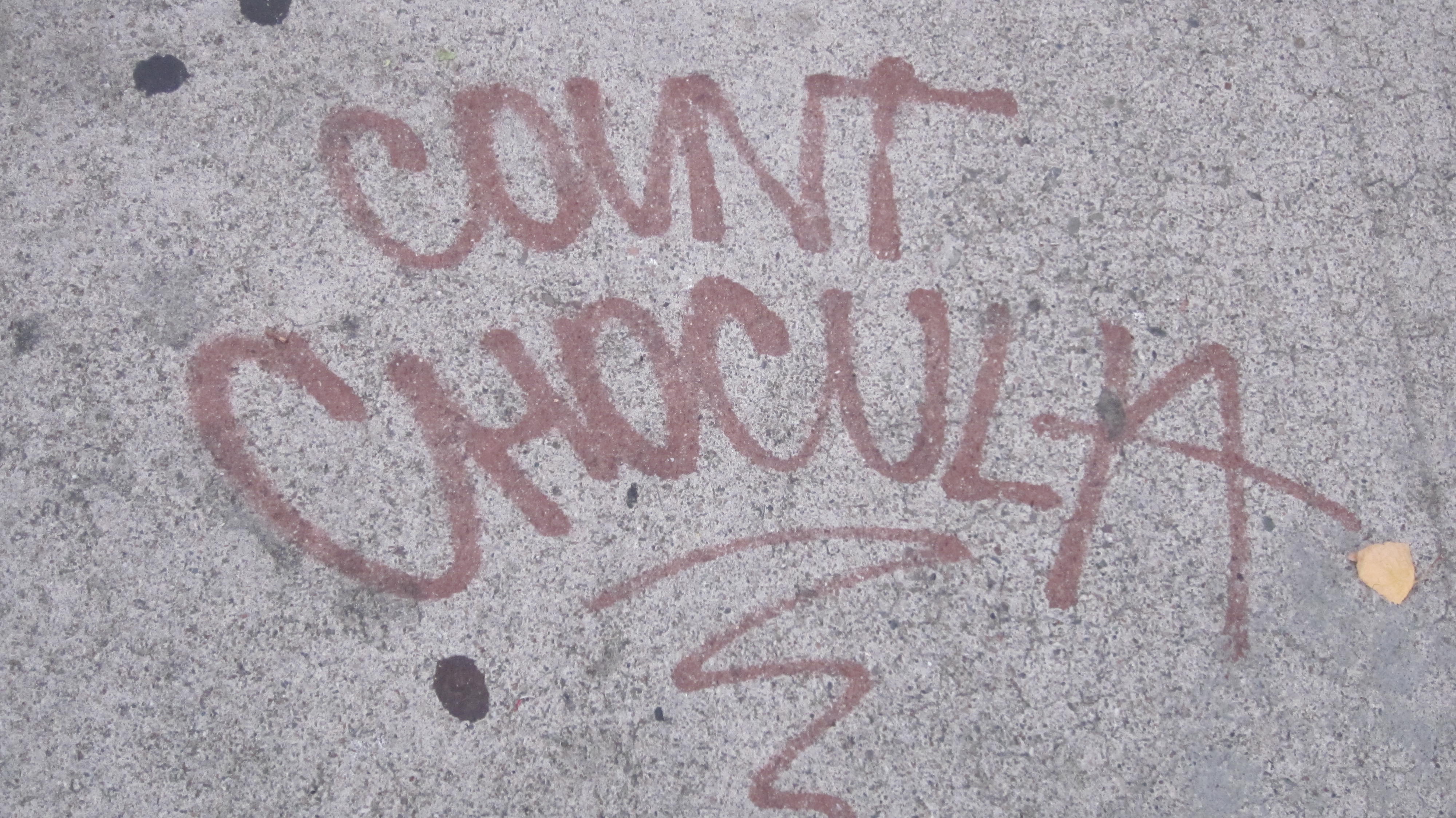 Graffiti tags on a storefront wall on Valencia Street in San Francisco