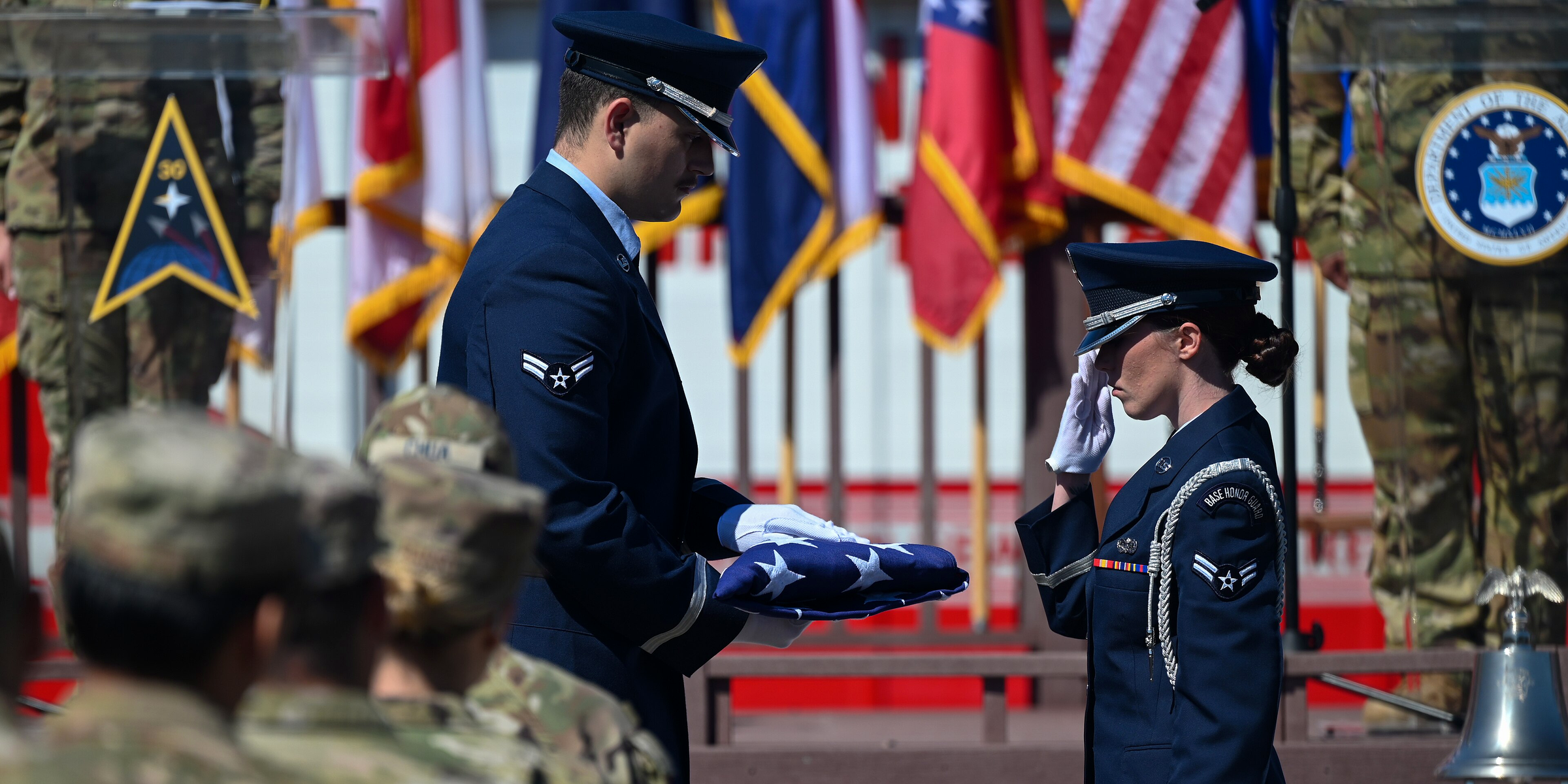 U.S. Air Force Base Honor Guard members fold the American flag during a 9/11 remembrance ceremony at Vandenberg Space Force Base, California